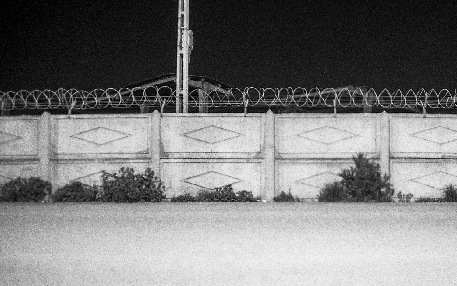 Concrete and barbwire