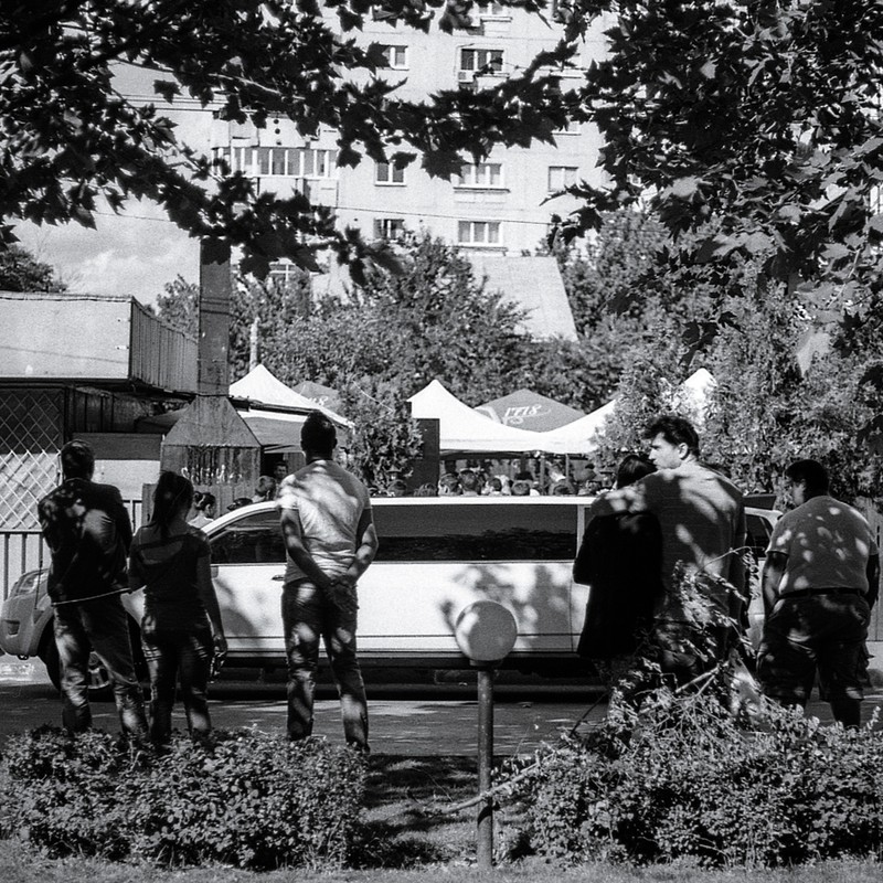 Stylish wedding - arriving by limo to the sleazy neighborhood terrace