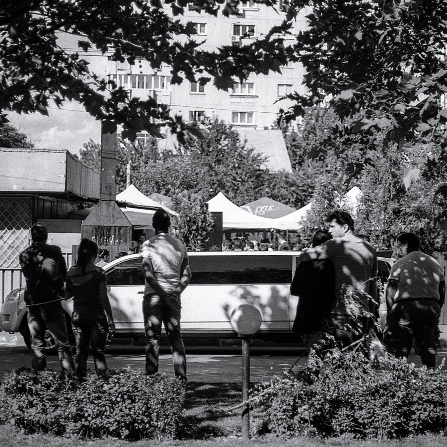 Stylish wedding - arriving by limo to the sleazy neighborhood terrace